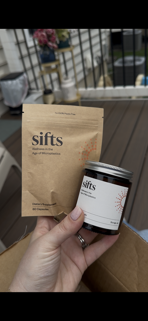 Sifts Daily jar and pouch in customer Jessie's hand